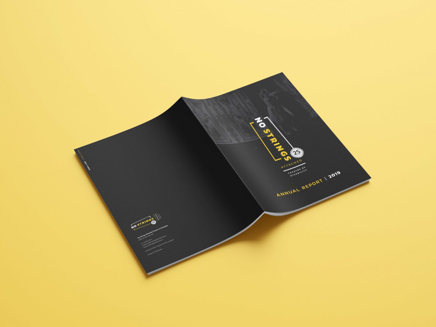 Annual report booklet laying flat with the cover showing, on a yellow background.